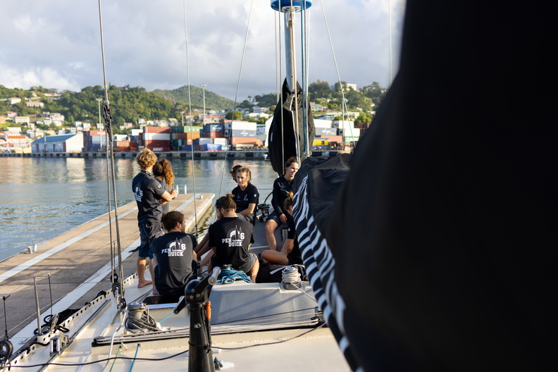 The crew of Pen Duick VI relax post-race