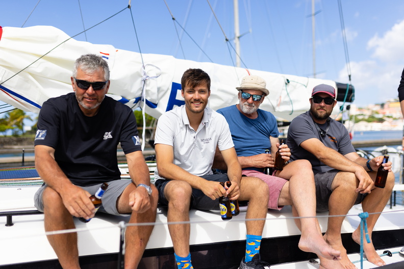 Pata Negra's crew relax after the end of a long race