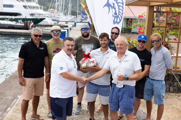 RORC Racing Manager Steve Cole hands over the IRC One winners trophy to Pata Negra in the 2023 RORC Transatlantic Race