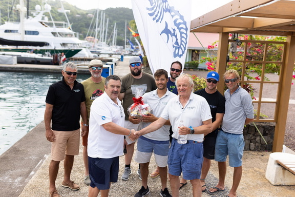 RORC Racing Manager Steve Cole hands over the IRC One winners trophy to Pata Negra in the 2023 RORC Transatlantic Race