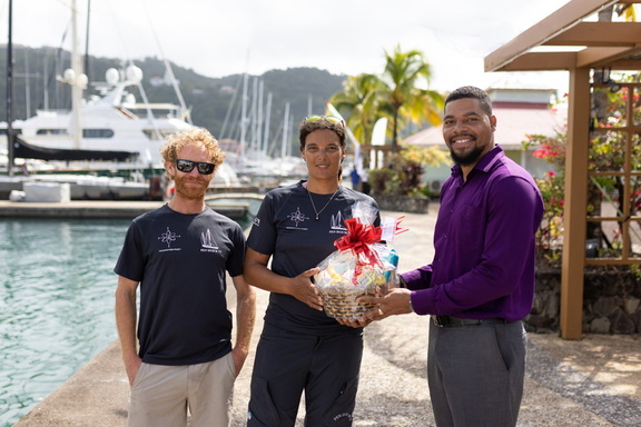 Pen Duick VI receive gift basket from Grenada Tourism Authority