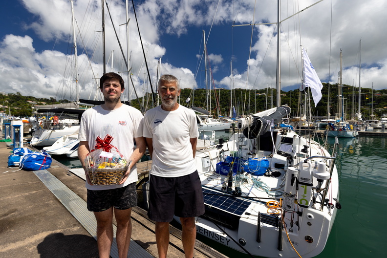 Refreshed after a night's sleep, Sea Bear's co-skippers Peter and Duncan Bacon receive their welcome basket