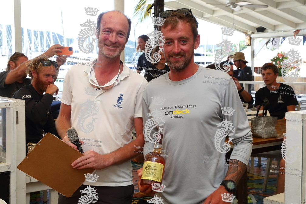 Stefan Kunstmann presents Spirit of Juno's skipper a prize for winning race 3 