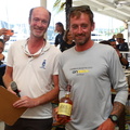 Stefan Kunstmann presents Spirit of Juno's skipper a prize for winning race 3 