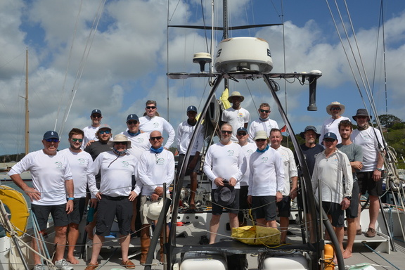 The crew of Green Dragon, the VO70, gather for a team photo
