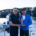 RORC CEO Jeremy Wilton greets Pyewacket skipper Ben Mitchell with the monohull line honours decanter
