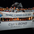 Cui Bono pose with the race banner