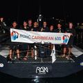 Rán's crew pose with the race banner