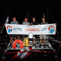 Tquila's crew pose with the race banner