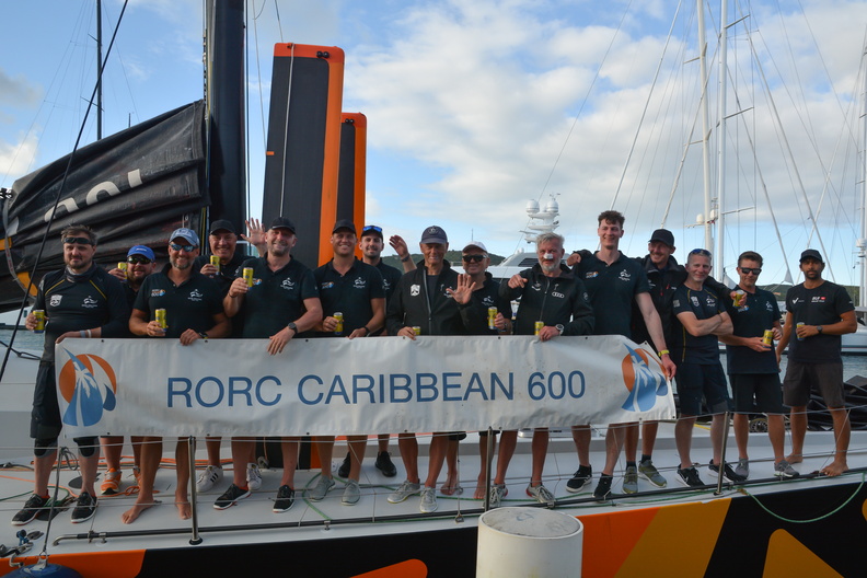 Ambersail 2 crew pose with the race banner