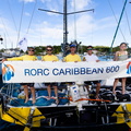 Velocity's crew pose with the race banner