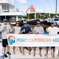 Class40 Kite's crew pose with the banner