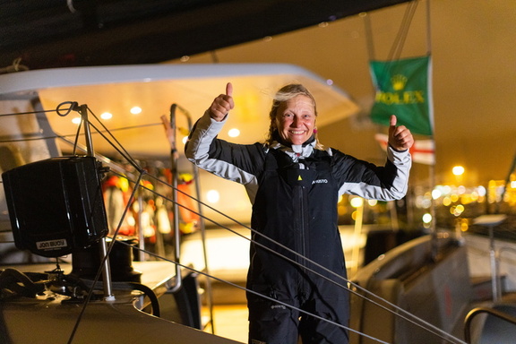 Crew celebrate finishing the race on board the Nigel Irons multihull Allegra after winning the Multihull class