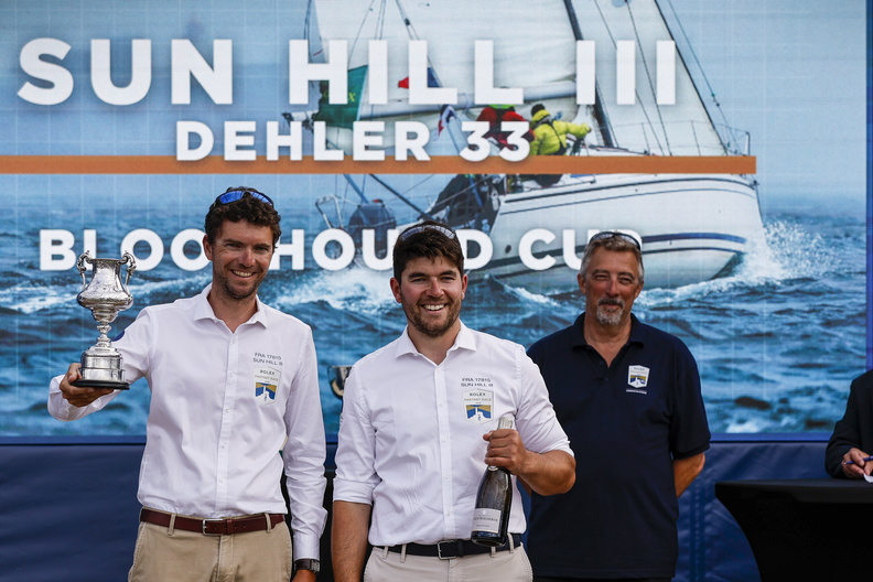 Francois Charles (left) and crew of Sun Hill III pick up the Bloodhound Cup for best corporate yacht