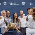 Mike Broughton and Ian Budgen, crew of Team Jajo with the yacht's charterer Clarke Murphy and his family, winner of IRC Super Zero