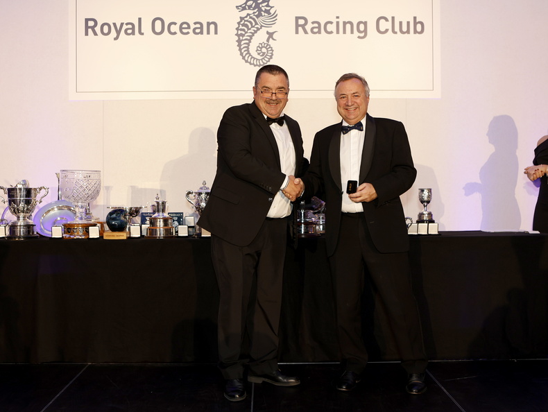Commodore James Neville collects Ino Noir's medallion for 3rd in IRC Zero from RORC Race Manager Steve Cole
