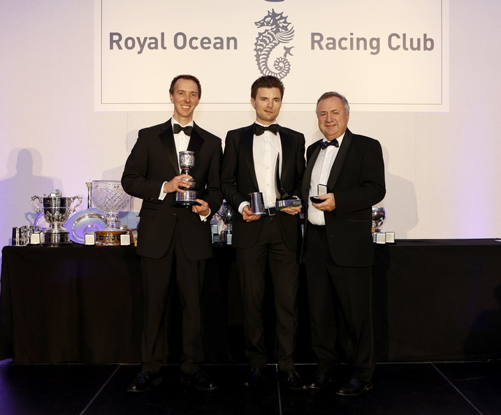 Tim Goodhew and Kelvin Matthews of Cora collect the Assuage Trophy for first in the Castle Rock Race, the Grenade Goblet for first in IRC Three and the Psipsina Trophy for first IRC Two-Handed  