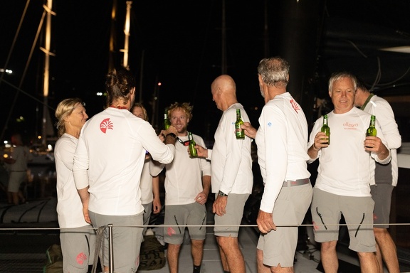 Adrian Keller and his crew of Allegra celebrate finishing the race