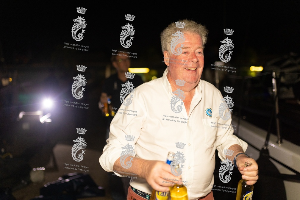 IMA Secretary General and former RORC Commodore Andrew McIrvine hands out the beers