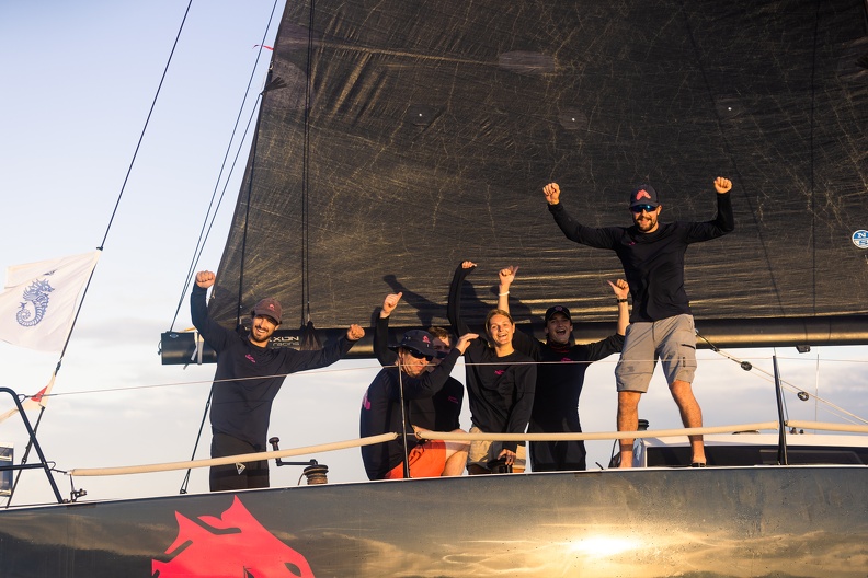 Dawn Treader crew celebrate as they cross the finish line