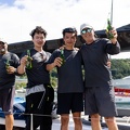 The Team 42 crew line up with their celebratory beers