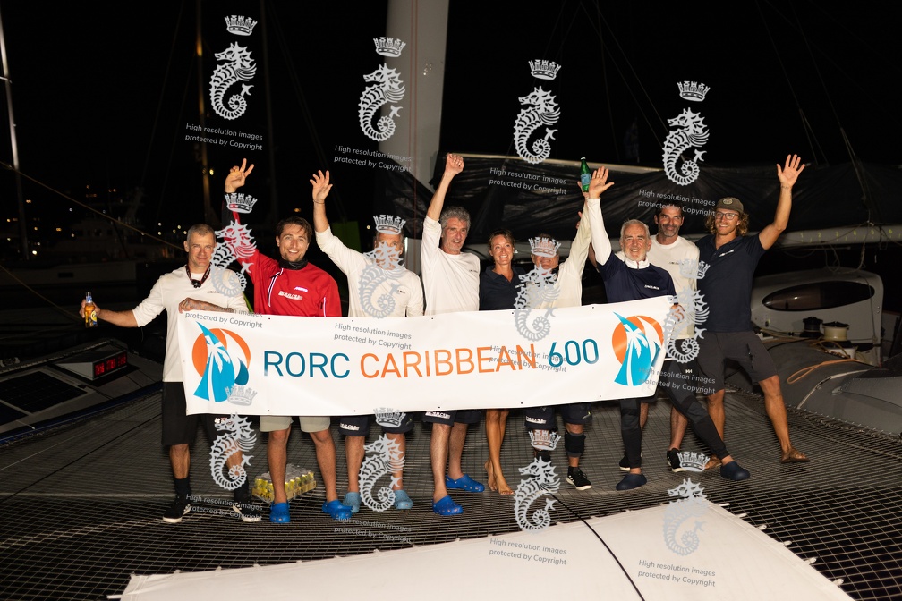 Zoulou celebrate with their race finish banner