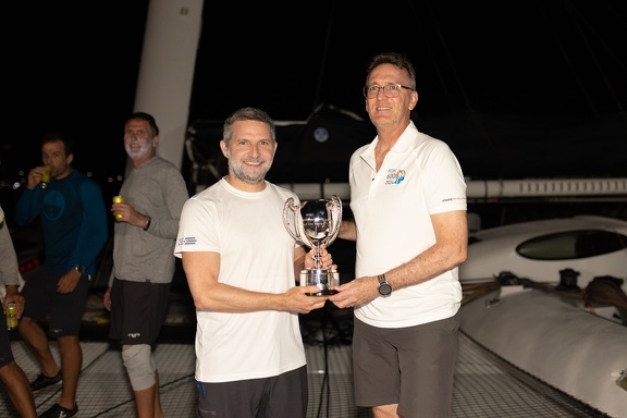 RORC CEO Jeremy Wilton presents Jason Carroll with the trophy