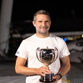 Jason Carroll with the trophy for first multihull