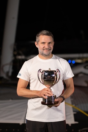 Jason Carroll with the trophy for first multihull