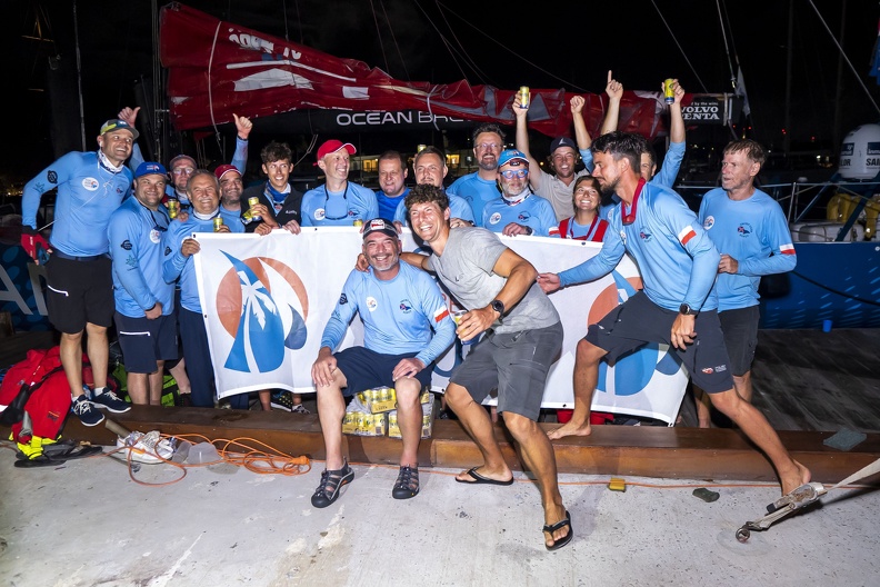 Ocean Breeze crew pose with the race banner