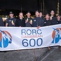 Ran crew pose with the race banner
