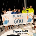 Triple Jack pose with the race banner