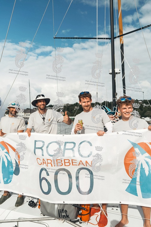 Sign for Com, Class40 sailed by Melwin Fink, pose for their photo after finishing second in class