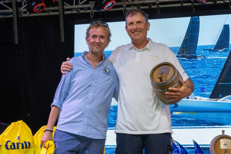 MOD70 Argo, owned by Jason Carroll, with Brian Thompson (right, next to Chris Jackson of RORC) on board won the Multihull class