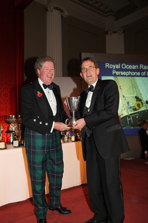 Vice Commodore, Tom Hayhoe, collects the Oldland Watts Aquadanca Trophy on behalf of Nigel Goodhew, Persephone of London