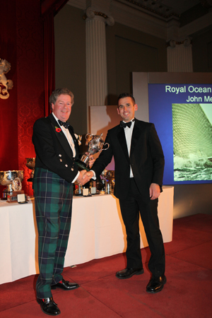 Commodore Andrew McIrvine presents the Europeans Trophy to Luke McCarthy, John Merricks II
