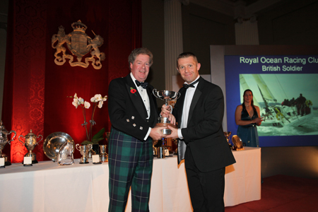 Commodore Andrew McIrvine presents the Haylock Cup to Craig Roxby, British Soldier