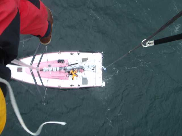Conrad Manning scales the rig onboard Rare to fix a wind wand